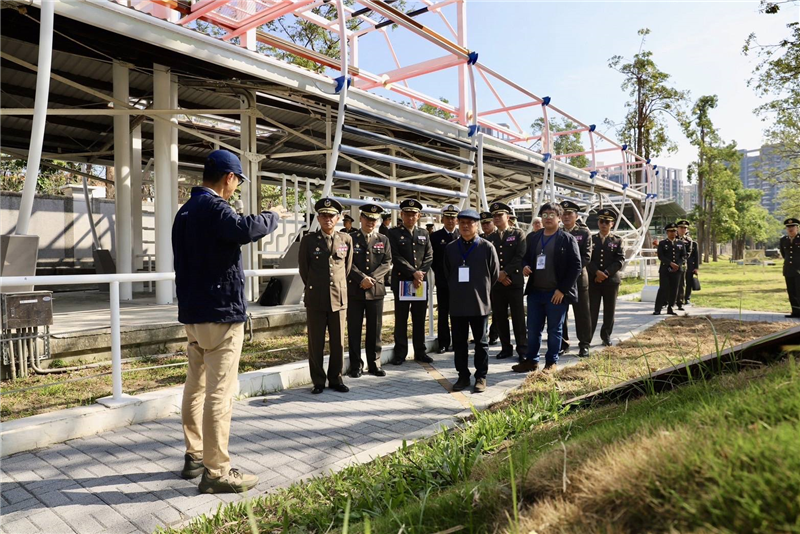 A tour guide explains the installation art