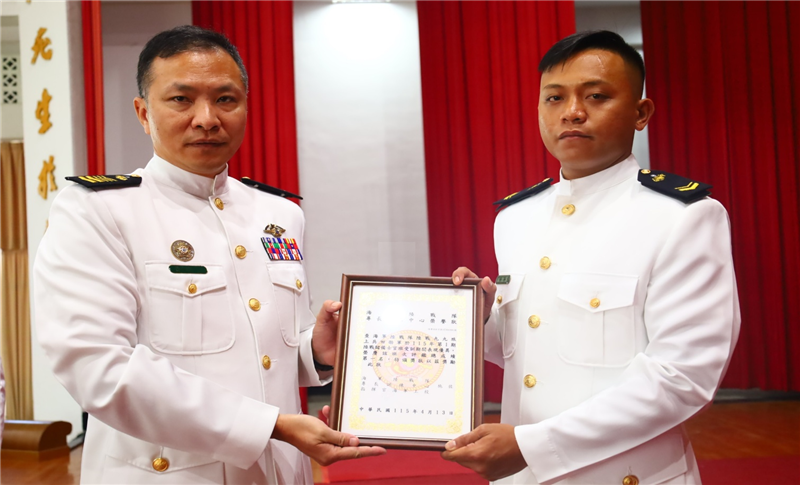 Command Sergeant Major Huang poses for a group photo with outstanding personnel