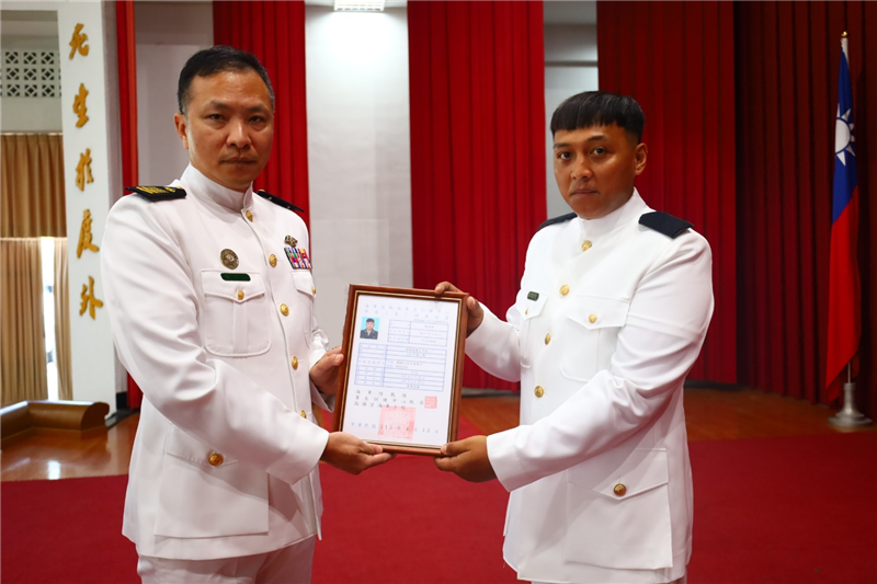 Command Sergeant Major Huang poses for a group photo with the certificate recipient
