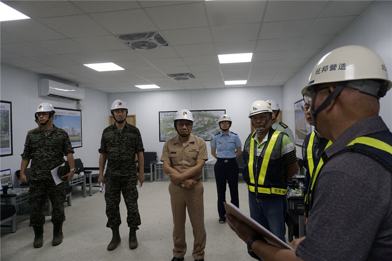 Vice Admiral Hsu listens to a project briefing from the construction management office.
